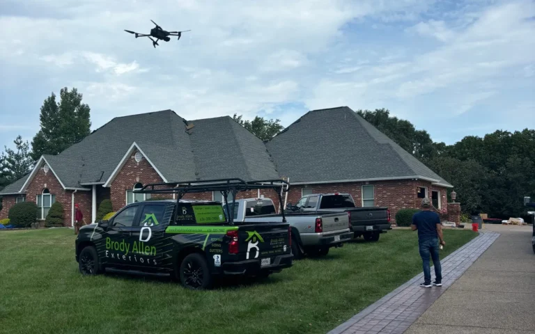 Brody Allen Exteriors work trucks and drone documenting damage in Lake St. Louis