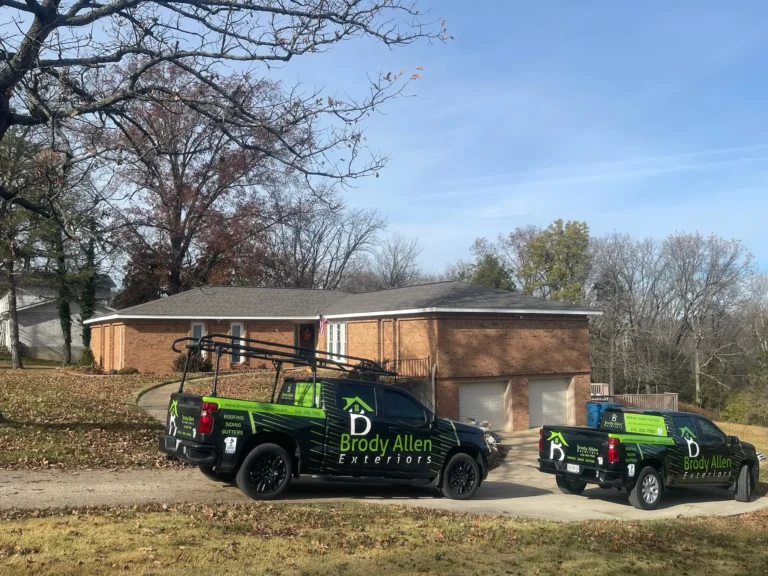 Brody Allen work trucks after new roof installation in St. Charles MO