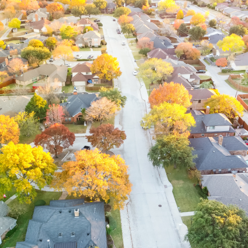 arial view of houses with roofs in the falll